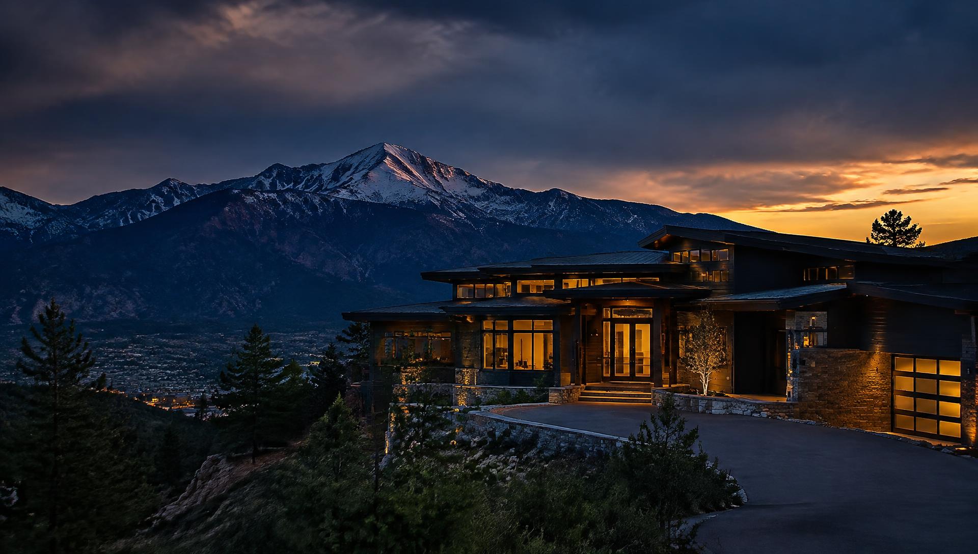 Luxury mountain home at dusk beneath Pikes Peak, Colorado Springs